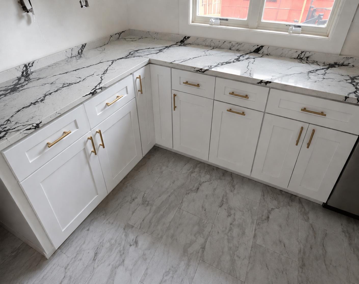 White shaker with brushed-gold hardware — A&J Cabinet Studio install